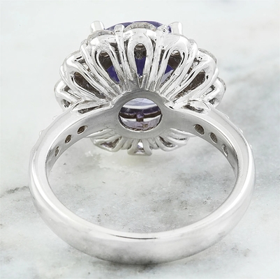 Los joyeros aporrean el acento Sterling Silver Ring de 1/4 quilate T.G.W. Tanzanite And White CZ