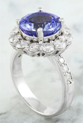 Los joyeros aporrean el acento Sterling Silver Ring de 1/4 quilate T.G.W. Tanzanite And White CZ